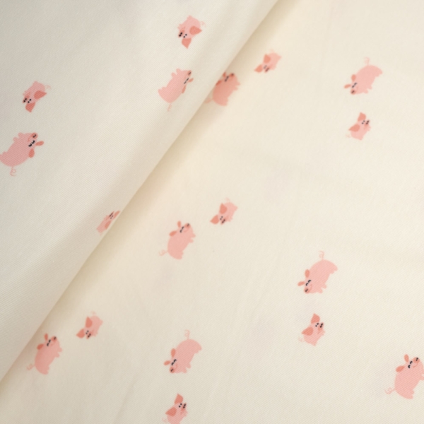 Baumwolljersey kleine Schweinchen ecru